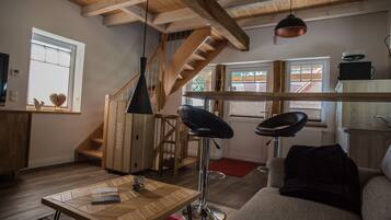 Apartment, 1 Bedroom, Balcony | Living room | 120-cm LED TV with cable channels, TV