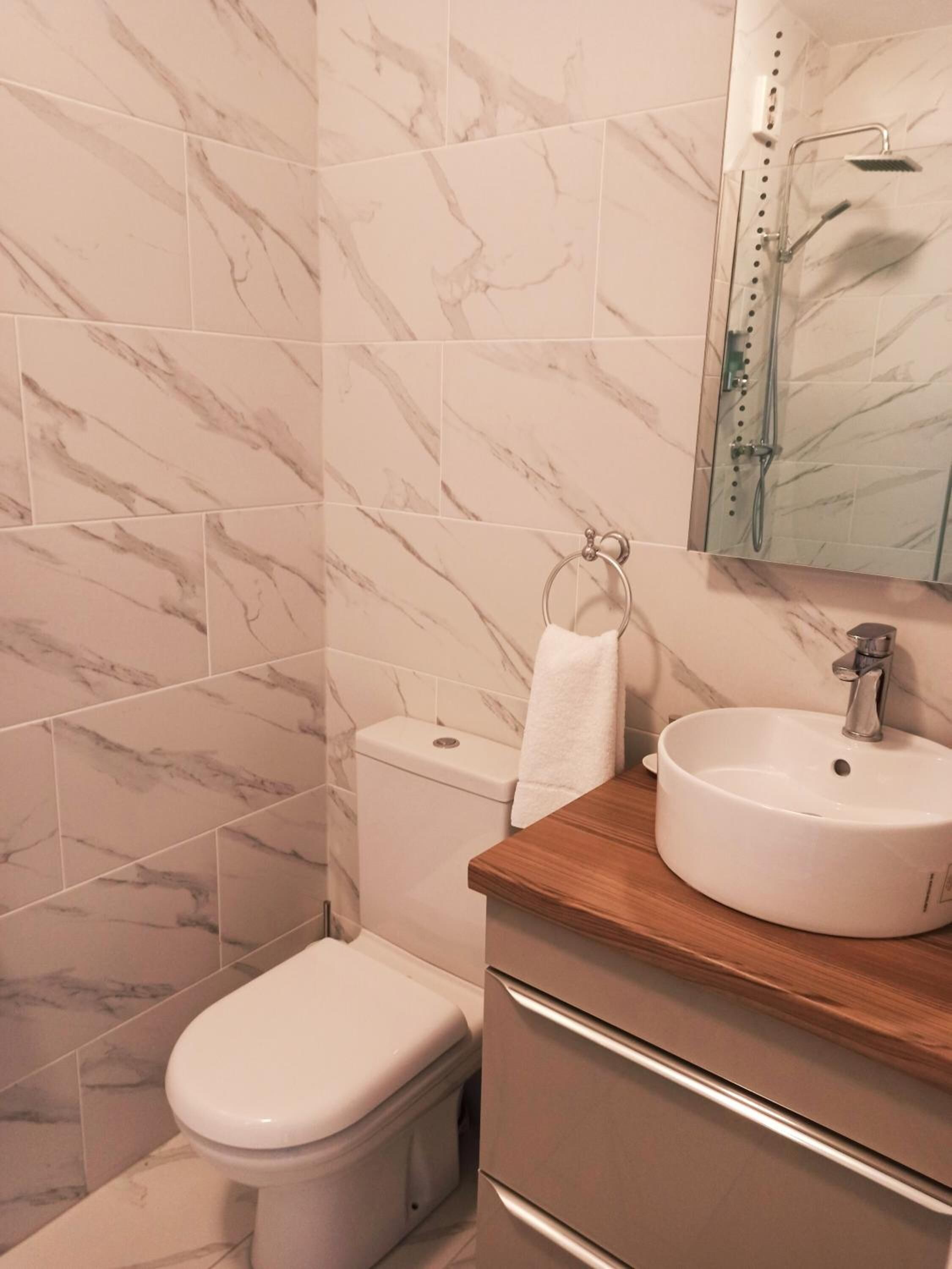 standard double room | bathroom | shower, hair dryer, towels, soap