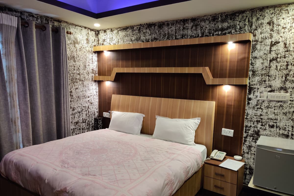 Habitación Deluxe | Ropa de cama de alta calidad, camas con efecto memoria y minibar
