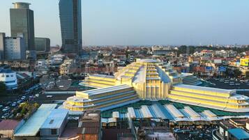 A large, multi-story building with a central courtyard and surrounding structures.