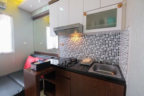 Apartment, 2 Bedrooms | Private kitchenette | Fridge, stovetop, electric kettle, cookware/dishes/utensils - Homey and Relaxing 2BR Green Pramuka Apartment (Jakarta)