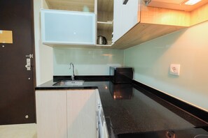Apartemen, 2 kamar tidur | Dapur kecil pribadi | Lemari es, kompor, dan peralatan masak/sendok-piring