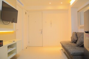 Living area - Pool View 2BR with Sofa Bed Bassura City Apartment (Jakarta)