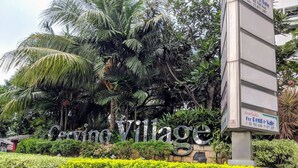 A sign for 'Cervino Village' with a contact number for rent and sale inquiries.
