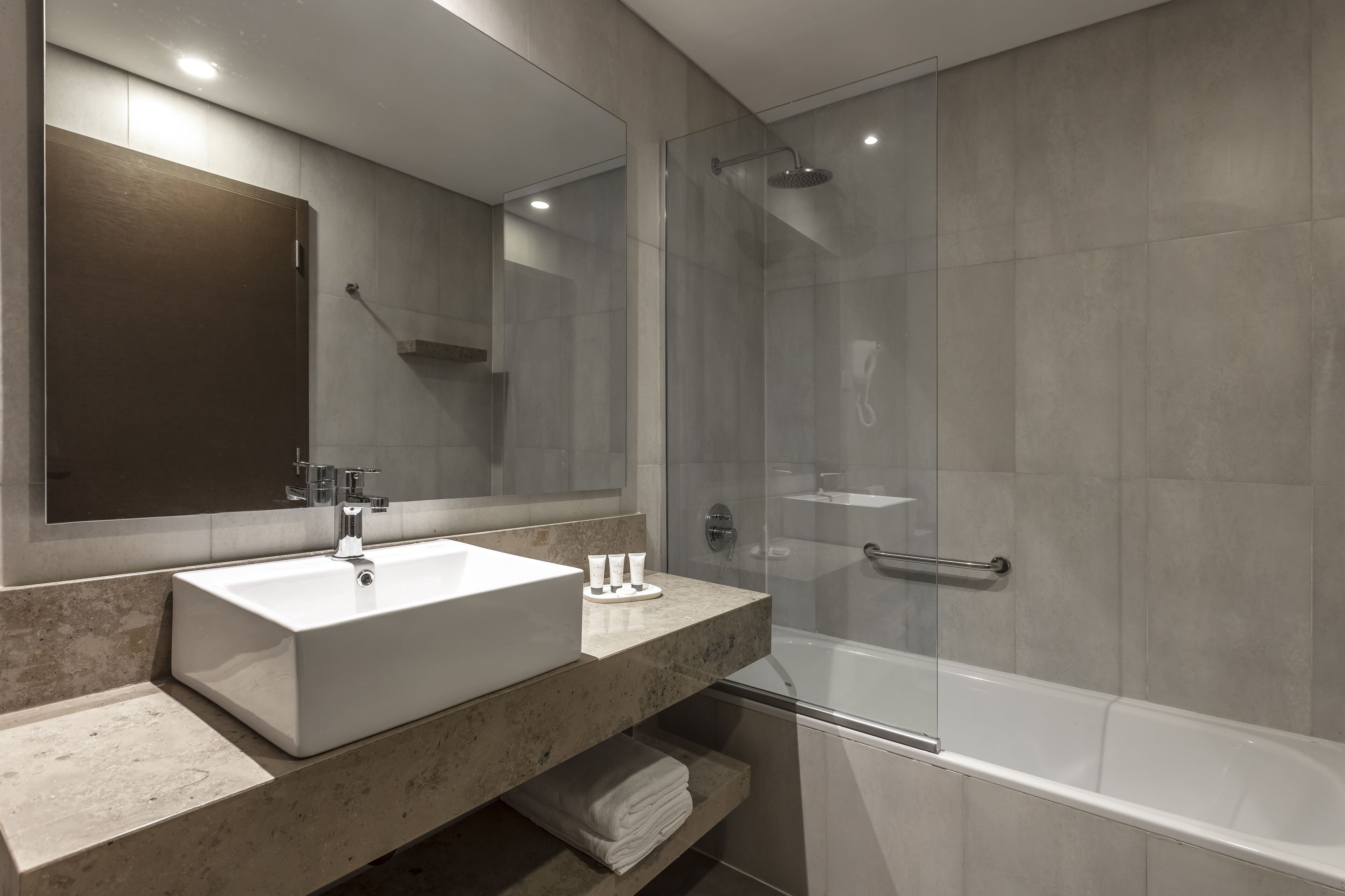 deep-soaking bathtub, rainfall showerhead, hair dryer, bidet