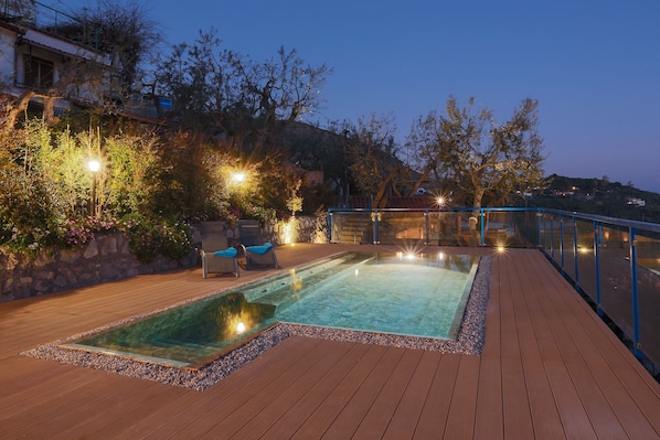Seasonal outdoor pool, pool umbrellas, pool loungers