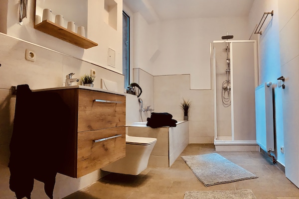 Exclusive Apartment, 2 Bedrooms, Ground Floor | Bathroom | Separate tub and shower, deep soaking tub, hair dryer, towels
