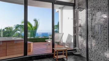 Shower, rainfall showerhead, towels, soap