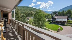 A balcony with a view of a mountain and a house. - Mill Creek Court Condos Just 100 yards from Gondola by RedAwning (Vail)