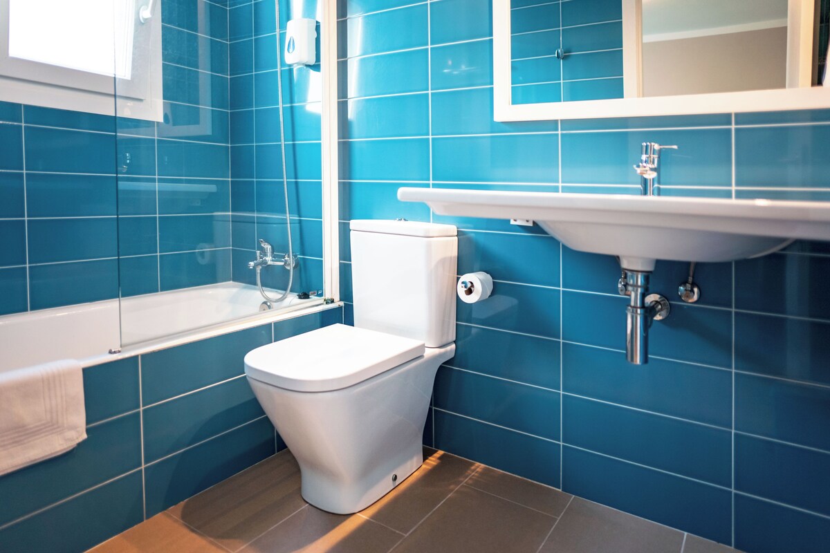Bathroom | Hair dryer, towels, soap, toilet paper