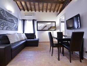 Apartment (2 Bedrooms) | Living area | 42-inch TV with satellite channels - Ibernesi 1 Apartment (Rome)
