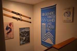 Decorative wall featuring Olympic memorabilia and artwork.