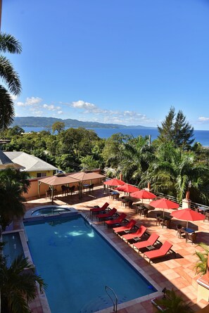 Outdoor pool, pool umbrellas, sun loungers