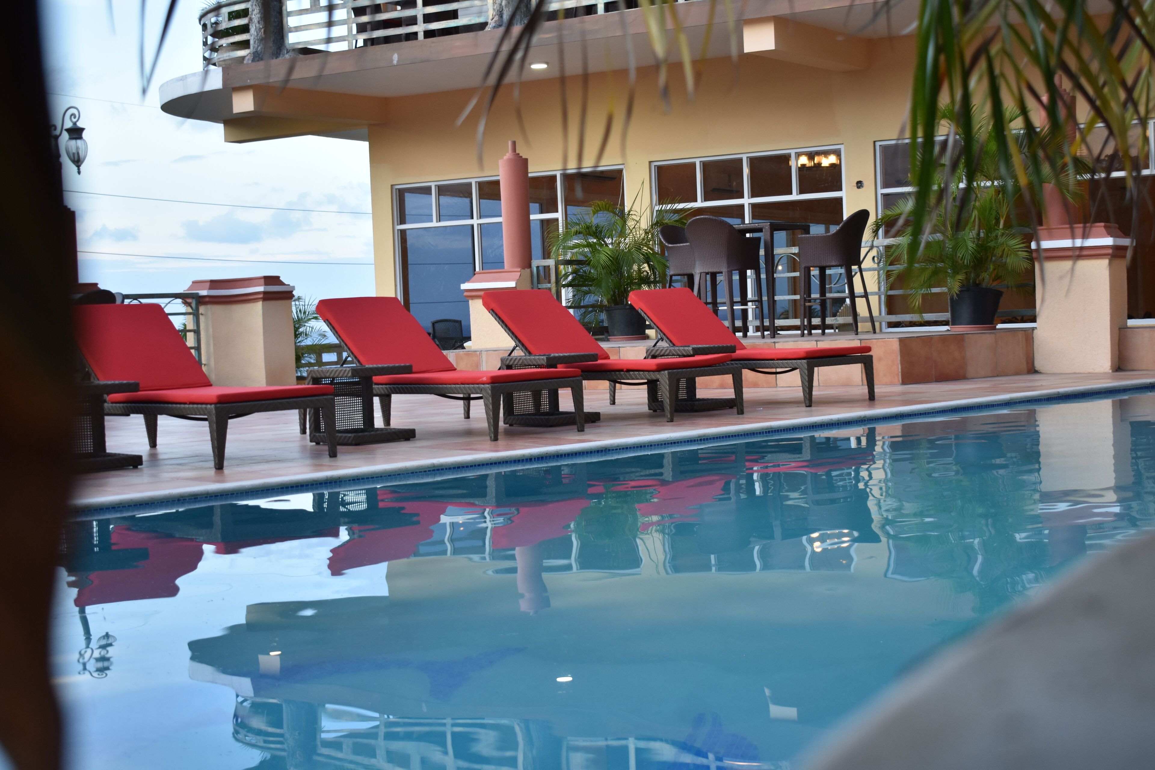 outdoor pool, pool umbrellas, pool loungers