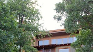 A multi-story building with a staircase leading to a balcony. - Large newly updated condo in close proximity to town and summer adventures!  (Durango)