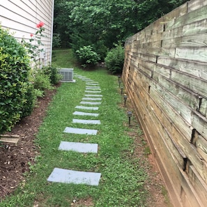 Walking pad to your entrance door. After parking on driveway Left side.