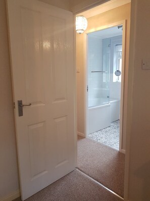 Combined shower/tub, hair dryer, towels, soap