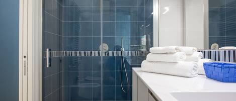 Hair dryer, towels, soap, shampoo