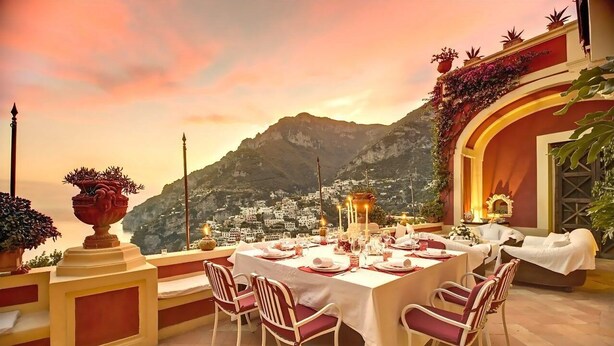 An outdoor dining area with a table set for four, overlooking a mountainous landscape. - ANTICO POSITANO - Five Bedroom Villa, Sleeps 9 (Positano)