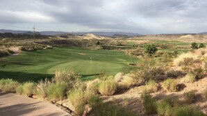 A golf course with a clear view of the green, fairways, and surrounding landscape. - Your home away from home! (Washington)