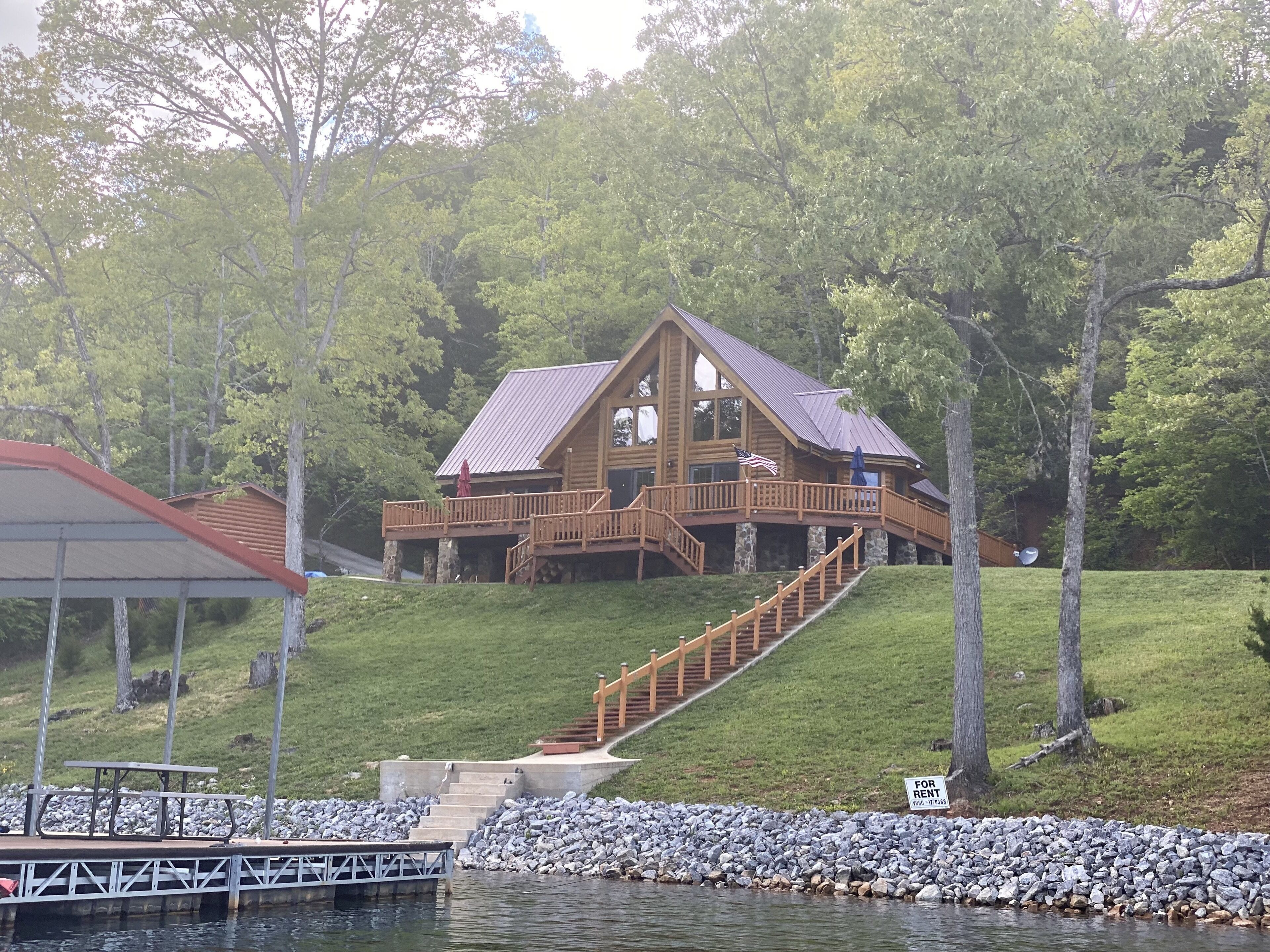 Breathtaking views from private custom log house with easy walk to private dock.