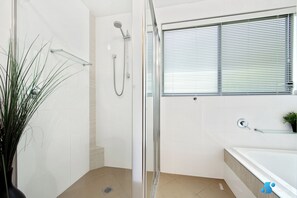 Bathtub, hair dryer, towels, soap