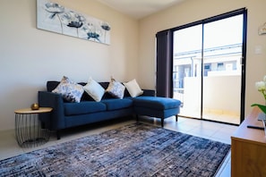 Classic Apartment, 2 Bedrooms, Non Smoking, Balcony | Living area | 32-inch TV with satellite channels