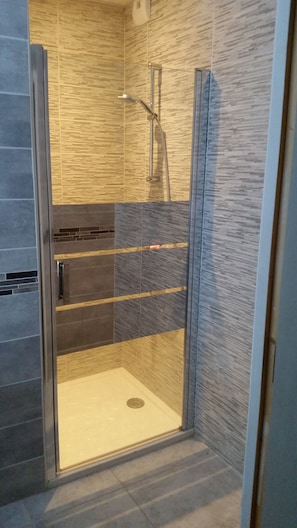 Bathtub, hair dryer, towels, soap