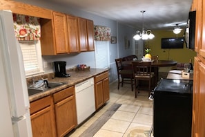 Enjoy cooking in this well-equipped kitchen with a dishwasher and coffee maker.