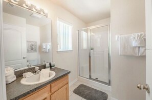 Combined shower/tub, hair dryer, towels, soap