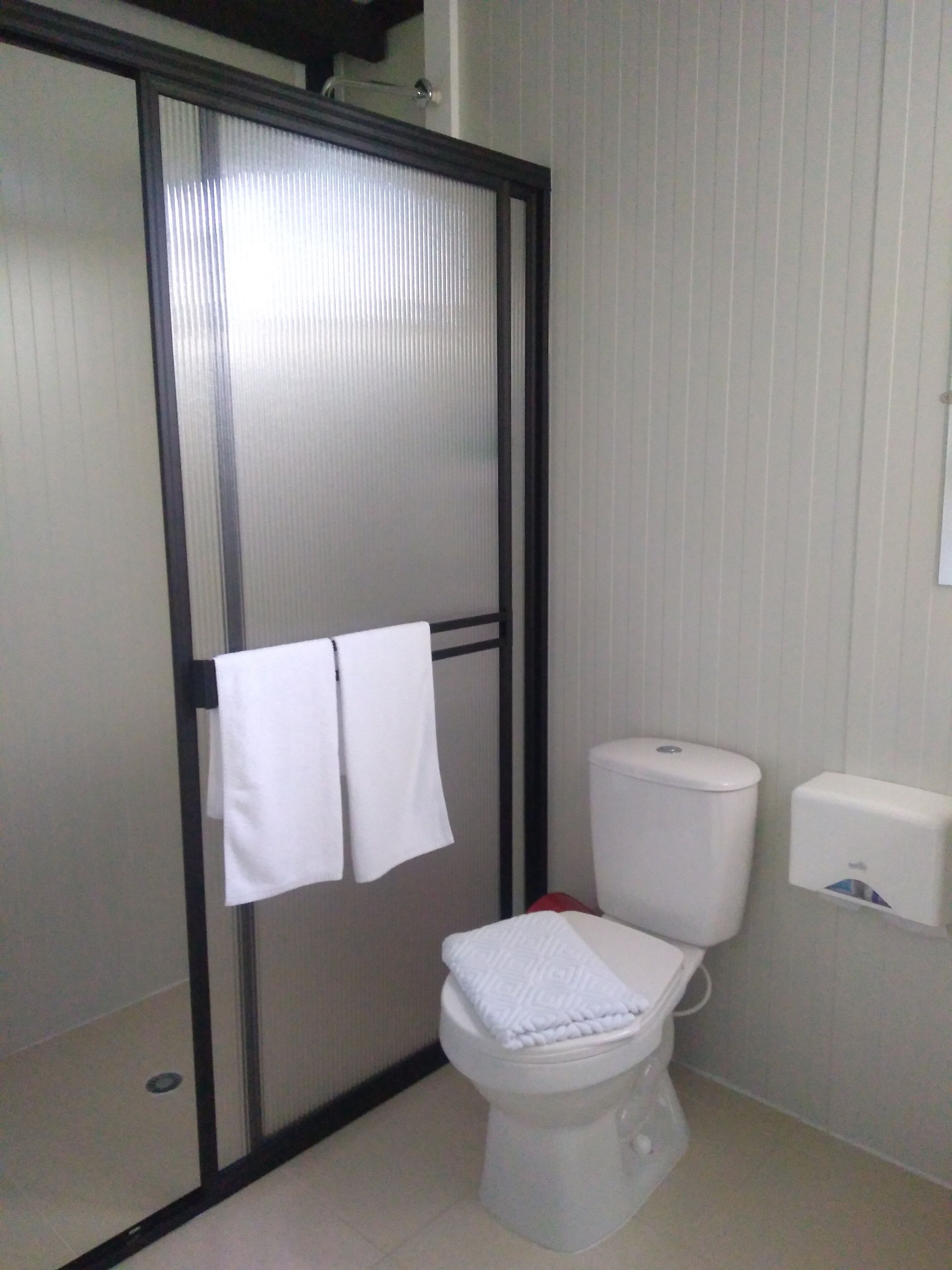 standard twin room | bathroom | shower, designer toiletries, towels, soap