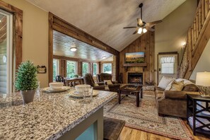 Flat-screen TV, fireplace, video games, foosball