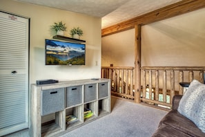 Flat-screen TV, fireplace, video games, foosball