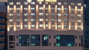 A multi-story hotel with a modern design, featuring a prominent sign at the top. - Brown Dot Hotel Jinju Chungmugong (Jinju)