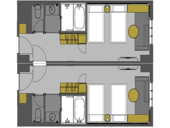 A floor plan of a hotel with two bathrooms, a kitchenette, and a dining area.