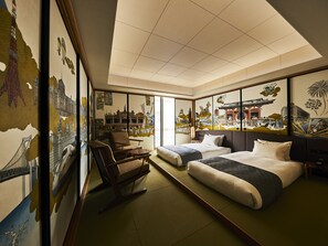 A hotel room with two beds, a chair, and artwork depicting cityscapes and cultural scenes. - Asakusa View Hotel Annex Rokku (Tokyo)