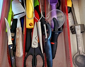A drawer containing various kitchen utensils including a knife, scissors, and a spatula. - Million Dollar View, seasonal pool, close activities w/in 2-5 miles. Yes, pets! (Grand Junction)