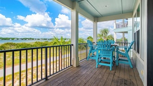 A covered porch with a view of the beach and ocean. - Lagoon Views | Steps to Gulf Access | Community Pool and Pier (gulf shores)