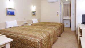A hotel room with two beds, a desk, a television, and a small refrigerator. - Family Lodge Hatagoya Tsuyama (Tsuyama)