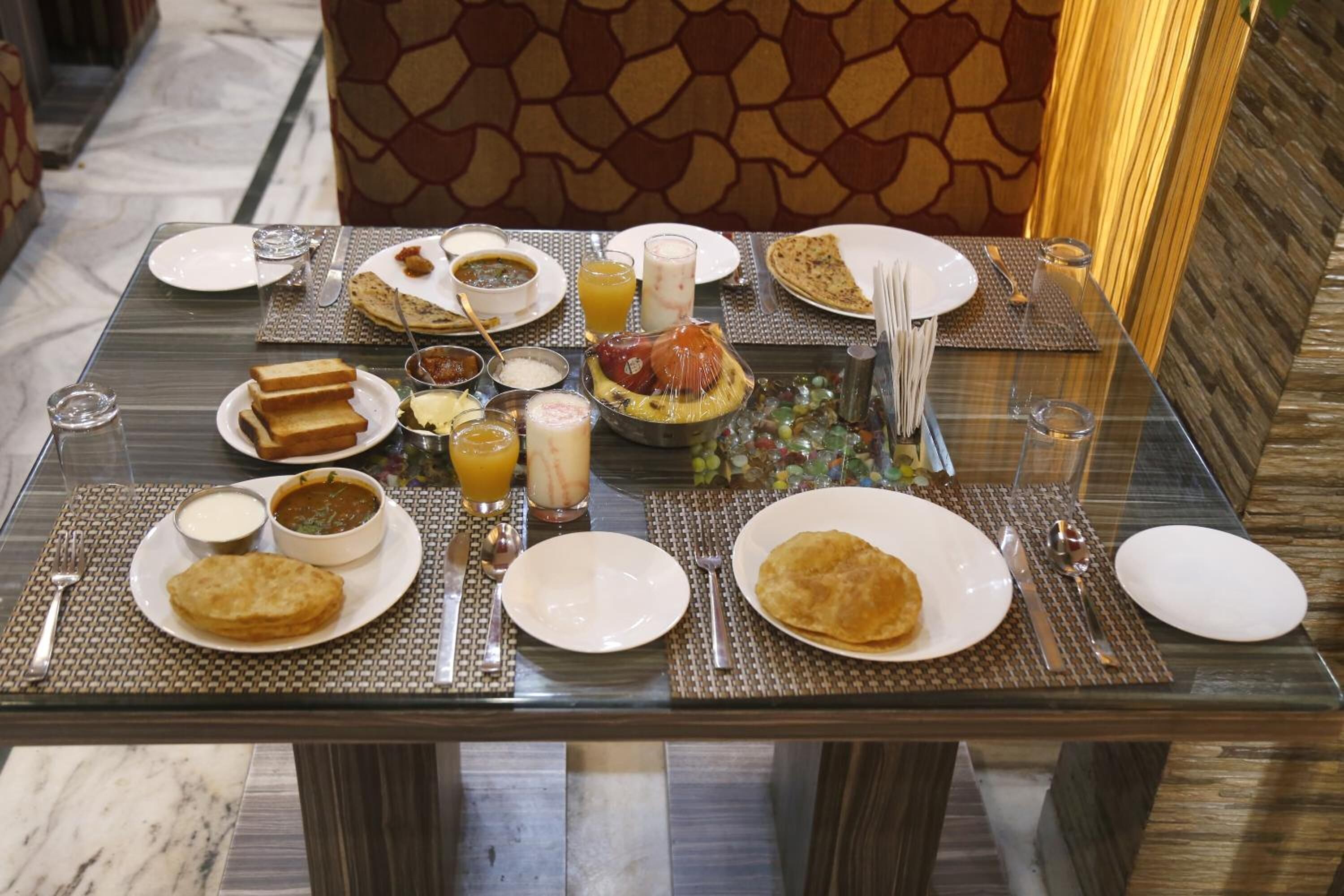 Breakfast, lunch, dinner served; Indian cuisine, garden views 