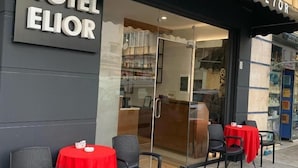 A hotel named "Hotel Elior" with outdoor seating and a glass entrance. - Hotel Elior  (Tirana)
