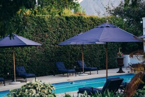 Outdoor pool, free pool cabanas, pool umbrellas