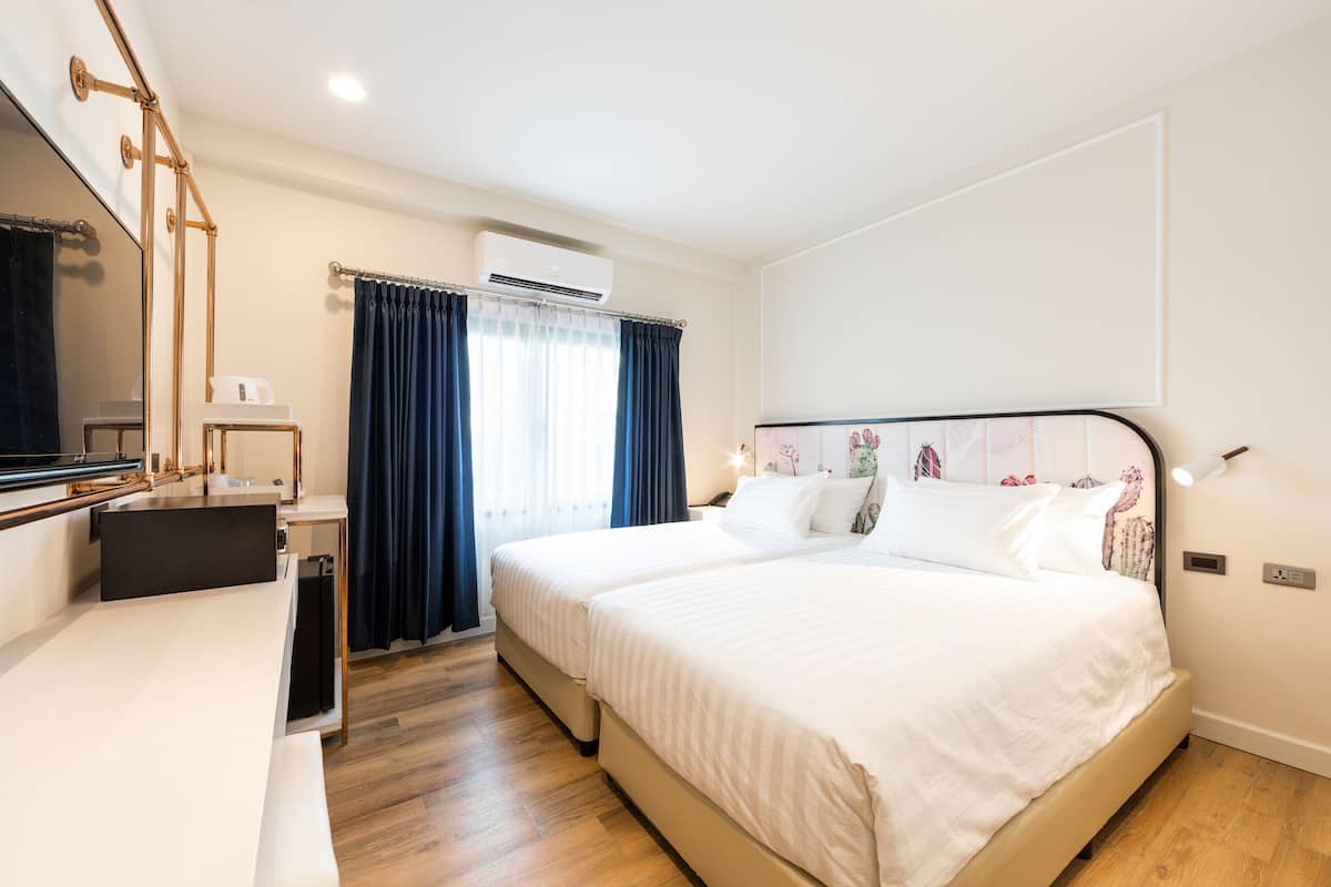 Deluxe Twin | 1 kamar tidur, brankas, dan didekorasi berbeda-beda