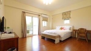 A bedroom with a bed, a desk, a chair, a window with curtains, a radiator, and a small trash bin. - Flower 280 (Ji'an)