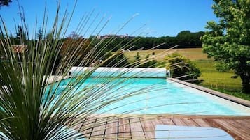 Seasonal outdoor pool, pool umbrellas, sun loungers