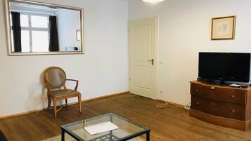 Appartement, 1 slaapkamer | Woonkamer | Een flatscreentelevisie