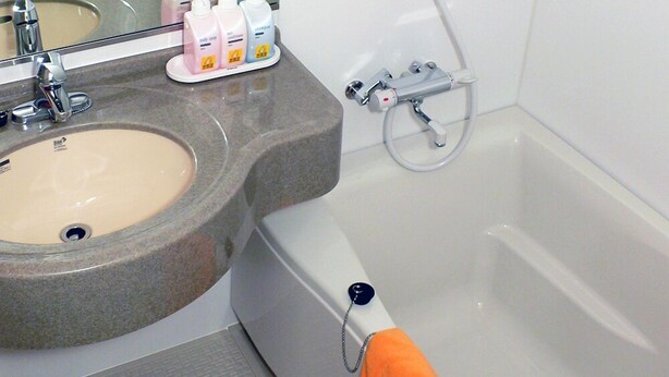 A bathroom with a sink, mirror, and bathtub. - Family Lodge Hatagoya Hikone (Aisho)