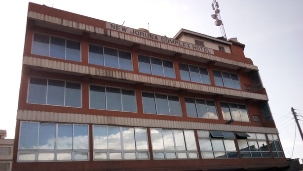 A multi-story building with a sign reading "New Jorunna Complex Hotel". - New Journa Complex Hotel (Naro Moru)