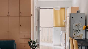 Executive Studio, Balcony, Mountain View | Living room | Flat-screen TV