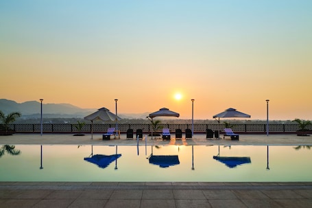 Indoor pool, outdoor pool, open 7:00 AM to 8:00 PM, sun loungers